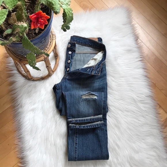 Leviās 501 button fly distressed jeans